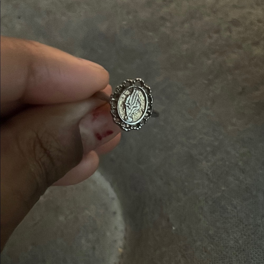 Elegant Silver Ring with Intricate Filigree and Halo Setting